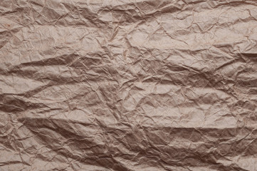 Crumpled kraft paper. Texture crumpled recycled old paper.