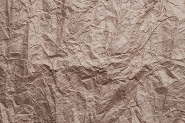 Crumpled kraft paper. Texture crumpled recycled old brown paper.