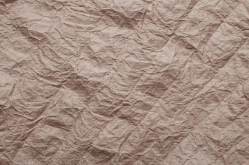 Crumpled kraft paper. Texture crumpled recycled old brown paper.