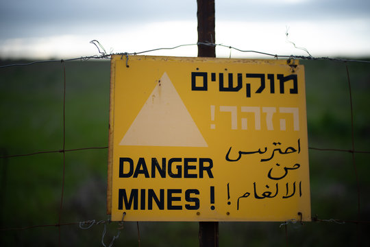 A warning sign for mines in the Golan Heights near the Syrian border