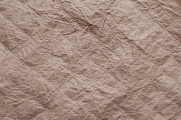 Crumpled kraft paper. Texture crumpled recycled brown paper.