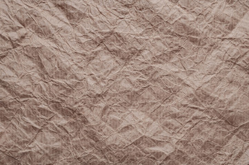 Crumpled kraft paper. Texture crumpled recycled old brown paper.