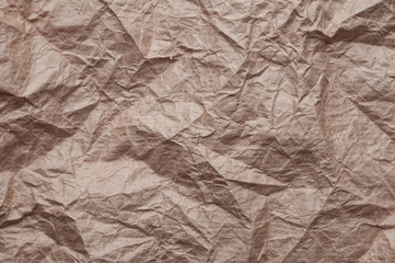Crumpled kraft paper. Texture crumpled recycled old brown paper.