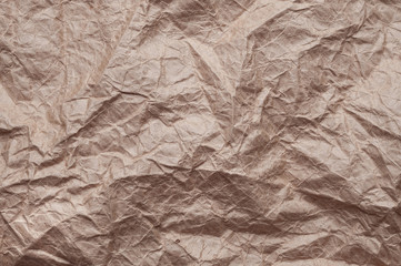 Crumpled kraft paper. Texture crumpled recycled old paper.