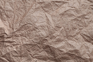 Crumpled kraft paper. Texture crumpled recycled old brown paper.