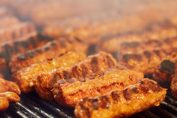 Meat rolls on grill