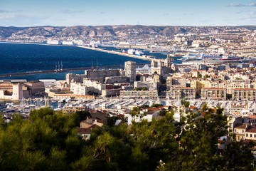 Unbelievable view panorama from observation deck near Notre Dame de la Garde on port,ships, bay, harbour and center of Marseilles, France with residential, historical, ancient buildings and monuments.