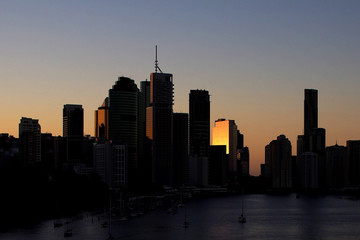 Fototapeta na wymiar Sunset and reflection over Brisbane towers