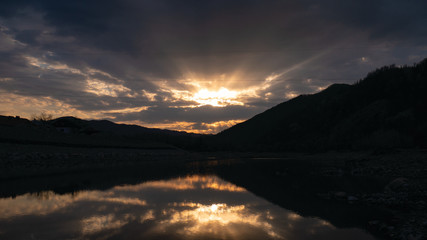 sunset in the mountains by the river Ukraine