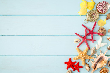 Sea stars and shells on wooden background.Top view travel or vacation concept. Summer background