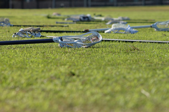 Picture of lacrosse sticks on the field before the game.