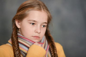 Close up portrait of a sick girl wearing scarf