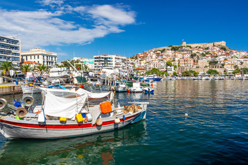 Boats at the Port of Kavala, Eastern Macedonia, Northern Greece and view of the old town in the background