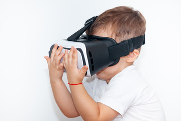 little boy with virtual reality glasses on a white background