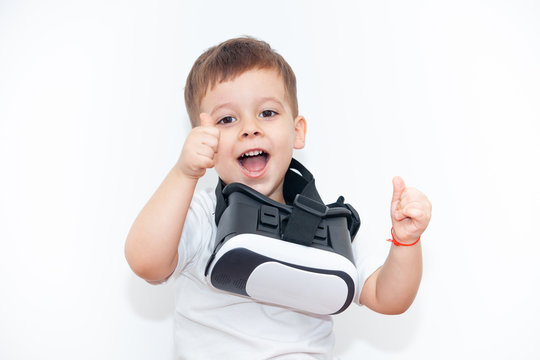 little boy with virtual reality glasses on a white background