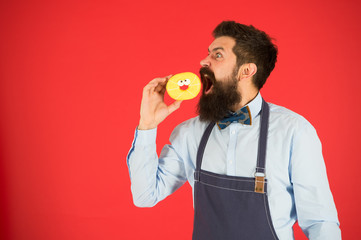 Chef man in cafe. Food calorie. Bearded man in apron. Diet and healthy food. baker hold donut. Funny hipster. Calorie. Feel hunger. Fast food. copy space. Healthy food is healthy life