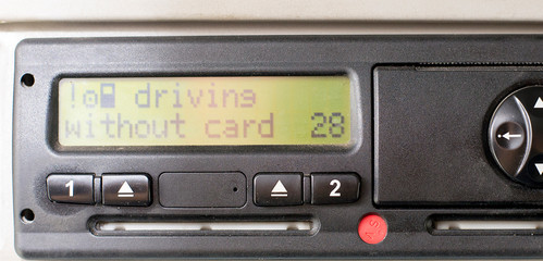 Digital tachograph display reads DRIVING WITHOUT CARD. No inserted card in the device. Insert the drivers card. No personal data