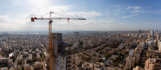 Netanya, Center District, Israel - April 1, 2019: Aerial panoramic view of a construction site in a...