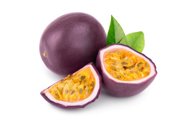 whole passion fruits and a half with leaves isolated on white background. Isolated maracuya