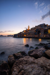 Fototapeta na wymiar Beautiful view of a Port of Jaffa during a colorful sunrise. Taken in Tel Aviv-Yafo, Israel.