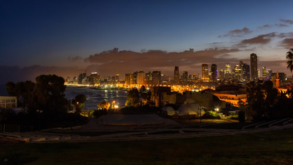 Plakat Panoramic view of a modern downtown city during a sunrise. Taken in Jaffa, Tel Aviv-Yafo, Israel,