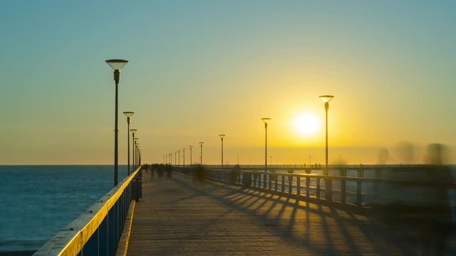 Sunset on the pier in Palanga, Lithuania, time-lapse