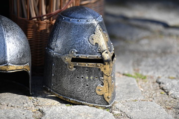A shiny knight helmet on a traditional market.
