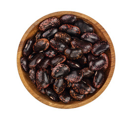 black kidney bean in wooden bowl isolated on white background. Top view. Flat lay