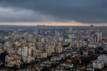 Fotobehang Aerial view of a residential neighborhood in a city during a cloudy sunrise. Taken in Netanya, Center District, Israel. © edb3_16