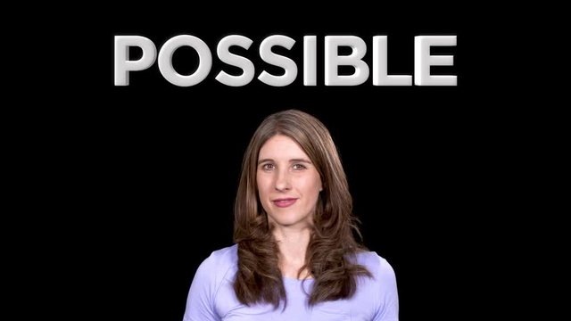 Motivational words as woman changes text on screen from impossible to possible