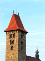 Fototapeta na wymiar Romanesque tower of a rural church in the village of Chrenovice, vertical shot, ancient building