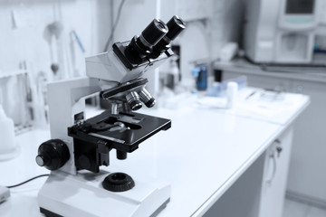 microscope on table in laboratory. Research and analysis