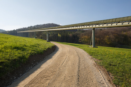 View of the conveyor belt transporting stones from Gabenchopf quarry to the cement plant. Village of Villigen, Switzerland.