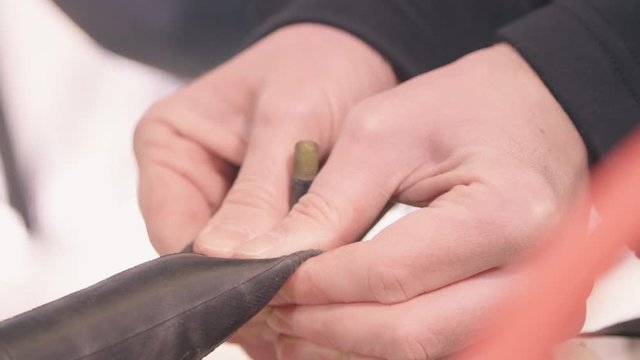 Pressing Repair Patch onto Bicycle Inner Tube