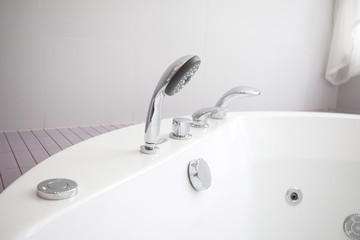 Luxury modern interior of stylish and elegant bathroom in hotel. Private apartment. Water relaxation treatments and spa at home. Minimalistic design in light shades