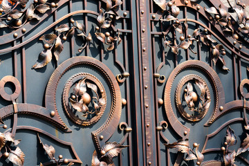 Beautiful forged leaves on metal gates.