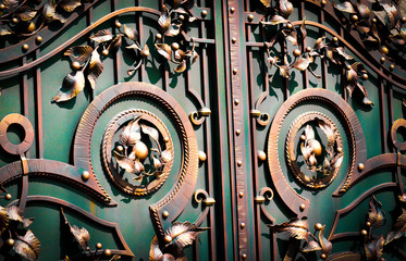 Beautiful forged leaves on metal gates.