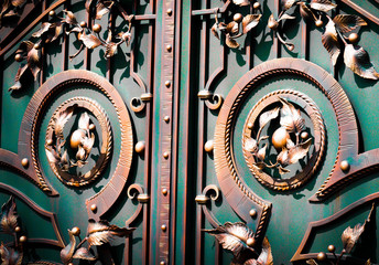 Beautiful forged leaves on metal gates.