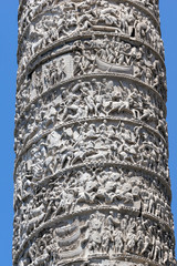 Architectural detail from of ancient Marcus Aurelius Column in front of Palazzo Chigi in city of Rome, Italy