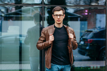 A stylish man in a black T-shirt. Street photo