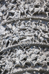 Architectural detail from of ancient Marcus Aurelius Column in front of Palazzo Chigi in city of Rome, Italy