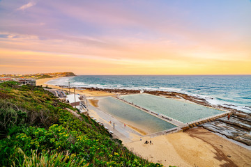 Sunset at Merewether beach overlooking the Merewether ocean baths in Newcastle, New South Wales, Australia