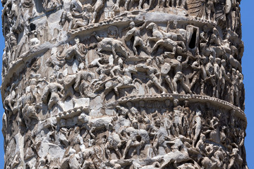 Architectural detail from of ancient Marcus Aurelius Column in front of Palazzo Chigi in city of Rome, Italy