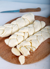 Turkish knitting cheese on wooden background.