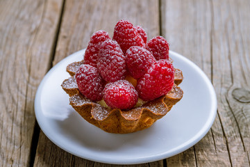 raspberry tartlet on a plate