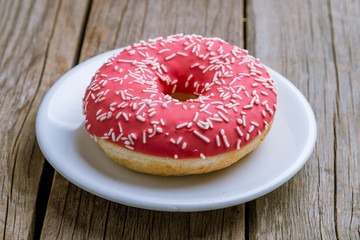 strawberry donut on a plate