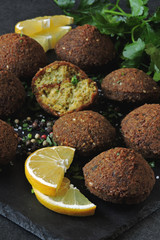Falafel with sauce, spices and herbs. Middle Eastern cuisine.