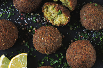 Falafel with sauce, spices and herbs. Middle Eastern cuisine.