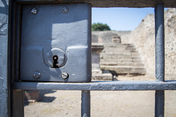 Black iron gate with key hole