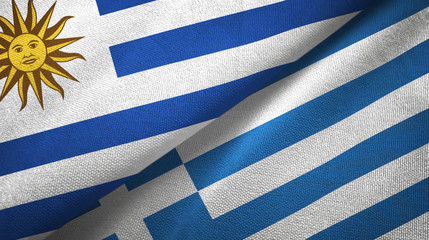 Uruguay and Greece two flags textile cloth, fabric texture